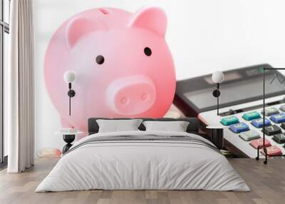 Saving money, piggy bank on coin and calculator : finance concept. Wall mural