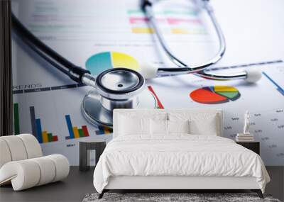 stethoscope and us dollar banknotes on chart or graph paper, financial, account, statistics and busi Wall mural