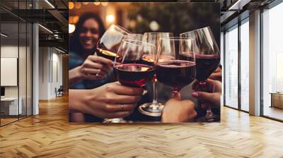 Group of young people celebrating and tasting or drinking red vine. Wall mural