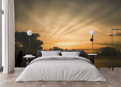 Many are waiting for the sun to rise above the sea. There are beautiful sky and clouds Wall mural