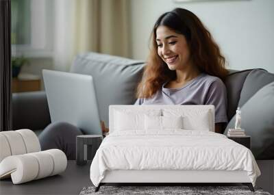 Content Woman in Loungewear Working on Couch with Laptop Wall mural