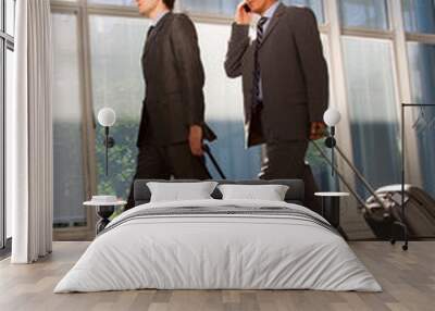 two businessman with trolley Wall mural