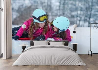 teen friends laugh on a winter day on the ski slope Wall mural