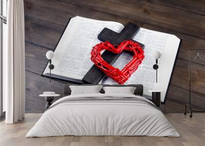 Bible open. Cross, crucifixion of Jesus. Red heart. Love concept. On a wooden table. Wall mural