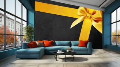 black gift card with golden ribbon bow, black friday concept Wall mural