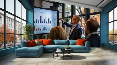 A conference room filled with professionals attending a data analysis workshop. The room is equipped with large screens displaying interactive visualizations, capturing the attention of the audience Wall mural