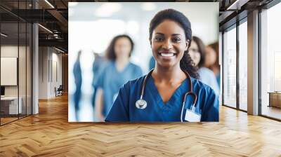 Happy female doctor and her medical teamwork in a hospital - professional healthcare and medicine concept Wall mural