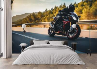 Motorcycle rider in helmet and leather jacket racing on asphalt road with blurred background Wall mural