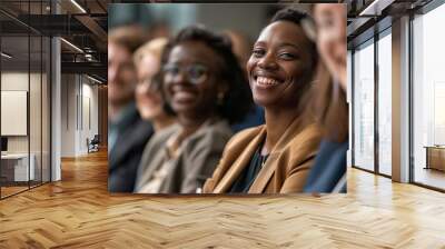 Teamwork in action: engaged and smiling professionals seated side by side in modern office setting Wall mural