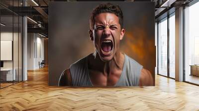 The young emotional angry man screaming on white studio background Wall mural