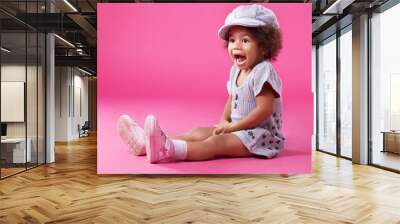 Stylish little girl playing up Wall mural