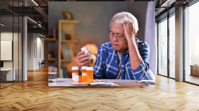 Asian senior man  with his medicine bottles Wall mural