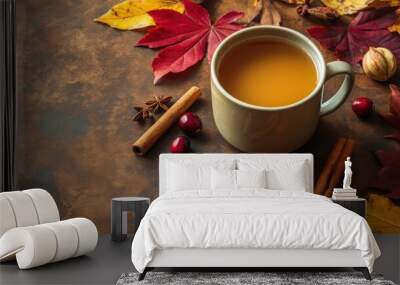 A steaming mug of hot cider, surrounded by cinnamon sticks Wall mural