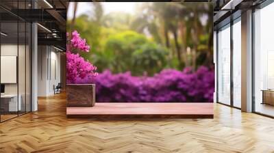 Empty wooden table top with purple flowers in blur garden background Wall mural