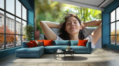 Joyful Young Caucasian Woman Relaxing on Outdoor Patio Sofa, Enjoying in Day Light | Home Lifestyle Concept Wall mural