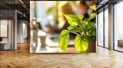 Modern cozy workplace, green nature sustainable concept office interior design, potted green plants on office desk, blurred background of people working Wall mural