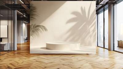 The soft pastel beige background, round podium, and palm leaf shadows create an elegant ambiance, ideal for showcasing products in a captivating and sophisticated way that attracts attention Wall mural