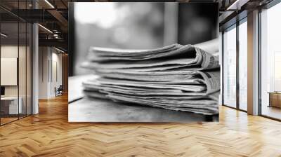 This aesthetic view of stacked black and white newspapers evokes nostalgia and classic charm, making it an inspiring choice for captivating social media content that resonates with viewers Wall mural