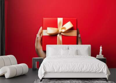 Hand holding red Gift box , christmas gift , happy new year, Generative Ai Wall mural