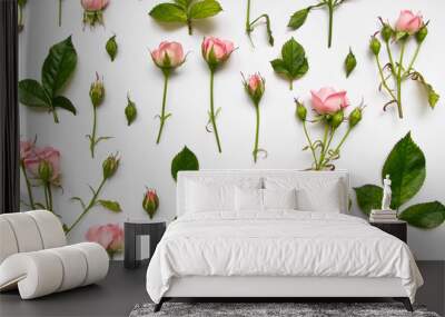 Decorative pattern with pink roses, leaves and buds on white background. Flat lay, top view Wall mural