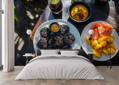 Happy Karwachauth, Sargi including black rice fritters on two plates, accompanied by tropical fruits and mango chutney, Sunlight Reflection Wall mural