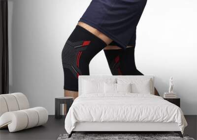 knee sleeve or knee cap shown on the models knee isolated on the white background Wall mural