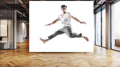 Professional guy dancer in motion isolated on white background, practicing modern hip-hop dance Wall mural