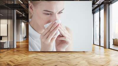 Rhinitis. Girl with napkin on white background Wall mural