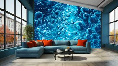 Sparkling Mineral Water Background. Blue bubbles of fresh soda float to the surface of drink to quench your thirst Wall mural