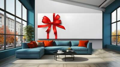 Isolated on a grey background with shadow, a minimal conceptual present signboard or a blank white gift voucher with a red ribbon bow Wall mural