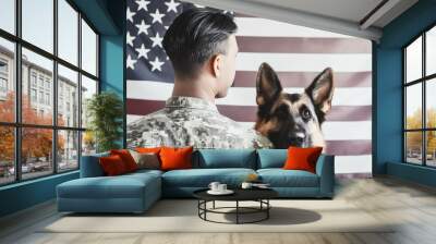 Back of american military man with service german shepherd on the background of the US flag, veterans day Wall mural