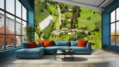 Capture stunning aerial shots of Ecuadorian farmland in Tungurahua province,showcasing its high altitude and vastness,with the help of our full size helicopter. Wall mural