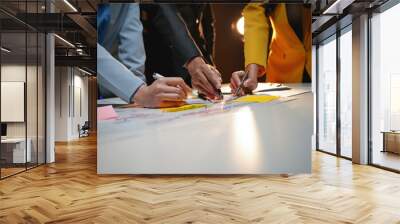 Business people analyzing data using sticky notes on a white table Wall mural