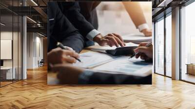 Business team working together planning investment at meeting. Close up view of business people advisors pointing at graph and analyzing financial report. Wall mural