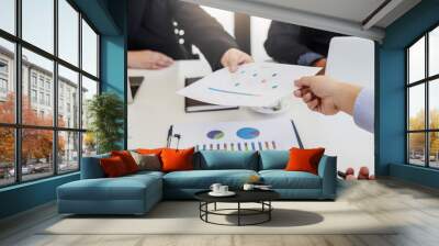 Businessman present graph financial information at the meeting. Wall mural