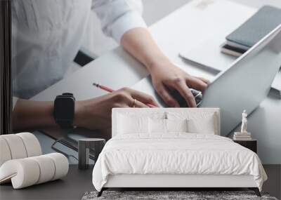 Close up. Woman hand working on a laptop keyboard. Wall mural