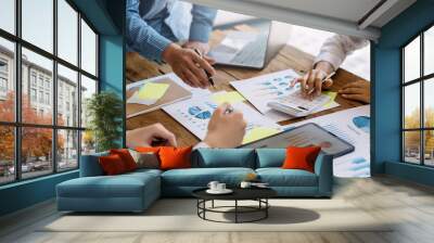 Group of business people brainstorm meeting presentation discussing planning strategy new business development working with new startup project in office. Wall mural