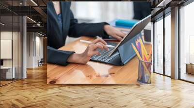 Image of businesswoman using digital tablet at the office. Wall mural