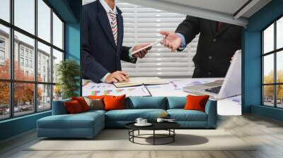 Two young businessman meeting to discuss about the investment and finance business. Wall mural