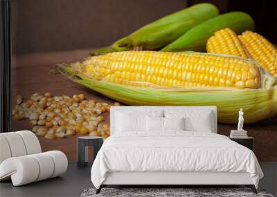 Organic fresh Corncobs or corn ears on wood background ,food Wall mural