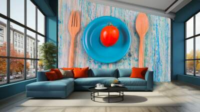 tomato in plate on blue wooden background. Top view with copy sp Wall mural