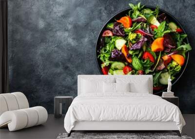 A fresh salad with a variety of colorful vegetables, with room for text on the side. No people. Wall mural