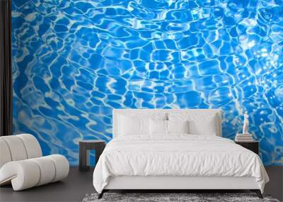 Blue water wave texture in swimming pool with Reflection of Sun Wall mural