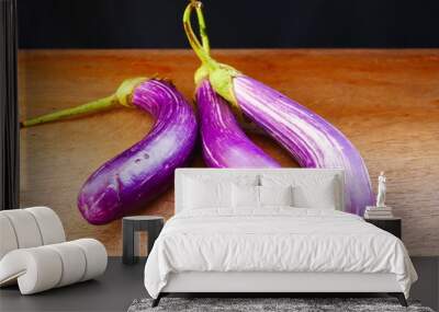 organic eggplant on wood background Wall mural