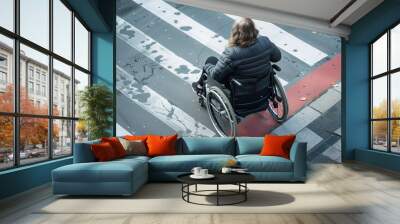 A woman in a wheelchair crossing the street safely Wall mural