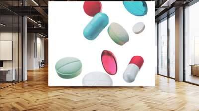 Many different colorful pills falling on white background Wall mural