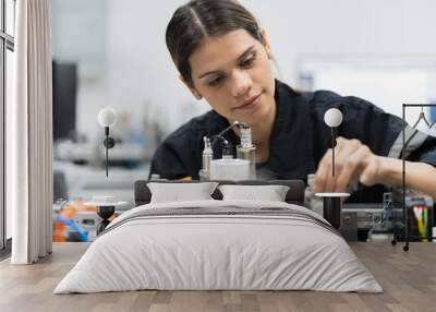 Female engineer training AI robot training kit and mechatronics engineering in the manufacturing automation and robotics academy room Wall mural