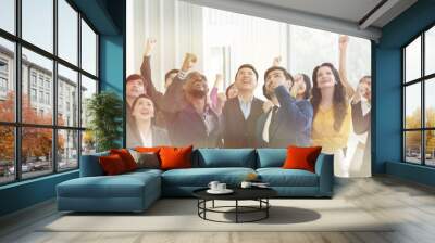 Group of business people raised up hands together for cooperate create power of teamwork in business conference room. Double exposure and banner cover Wall mural