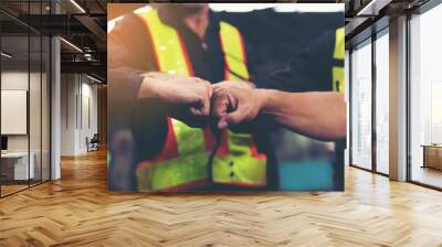 Group of male factory workers standing and show their hands after finished work in industry factory, wearing safety uniform and helmet. Factory workers working completed finish job. Successful of work Wall mural