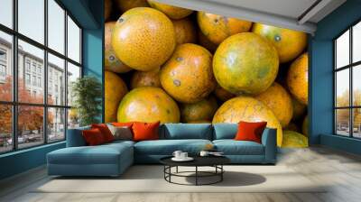 The oranges are piled on the shelves that are sold in the market Wall mural